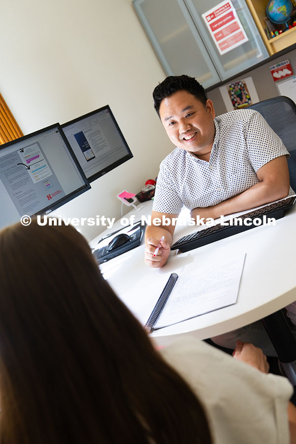 Donny Bui, an academic success coach in the Center for Academic Success and Transition, meets with K