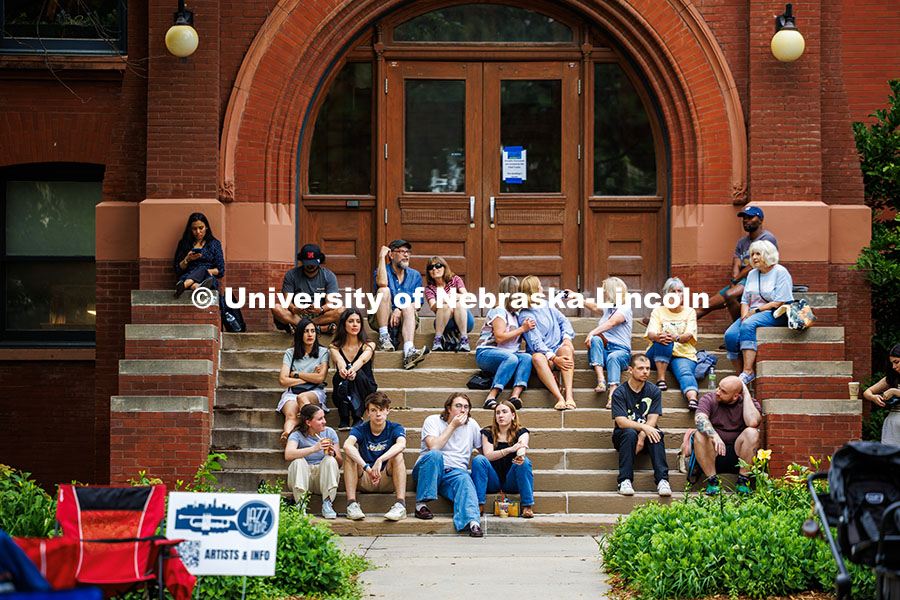 250625_Jazz_In_June_259.jpg A group of spectators sit on the stairs of Architecture Hall for the final session of Jazz in June.