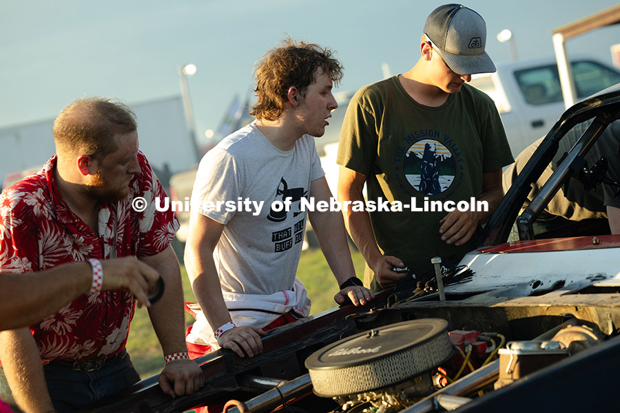 250711_Engineering_2733.jpg Members of the UNL Figure 8 Racing Team troubleshoot in the parking lot south of the Polk County Fai