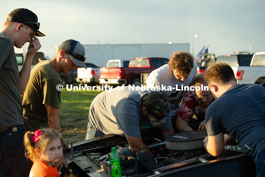 250711_Engineering_2740.jpg Members of the UNL Figure 8 Racing Team troubleshoot in the parking lot south of the Polk County Fai