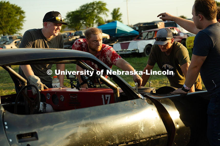 250711_Engineering_2748.jpg Members of the UNL Figure 8 Racing Team troubleshoot in the parking lot south of the Polk County Fai