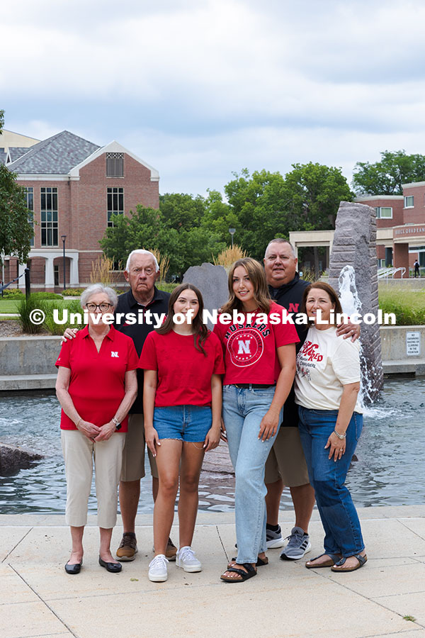 Sisters Madison and Lauren Haring pose with their family in front of Broyhill Fountain. The Haring f