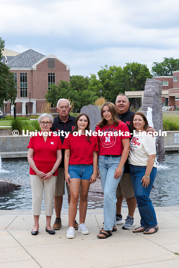 250716_PSA_Haring_2907.jpg Sisters Madison and Lauren Haring pose with their family in front of Broyhill Fountain. The Haring f
