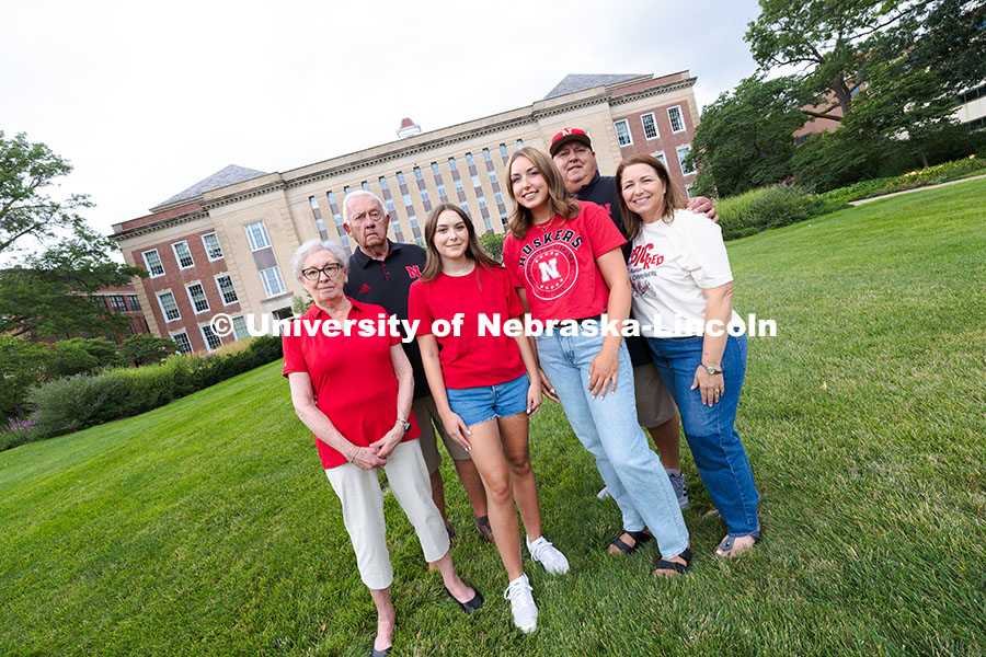 250716_PSA_Haring_3047.jpg Sisters Madison and Lauren Haring pose with their family in front of Love Library. The Haring family
