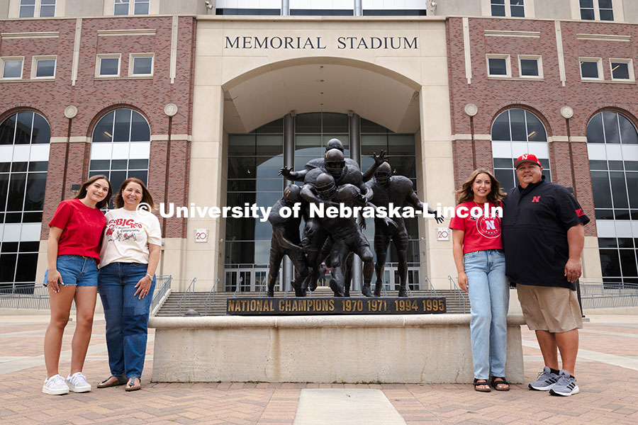 250716_PSA_Haring_3109.jpg Sisters Madison and Lauren Haring pose with their family outside of Memorial Stadium. The Haring fam