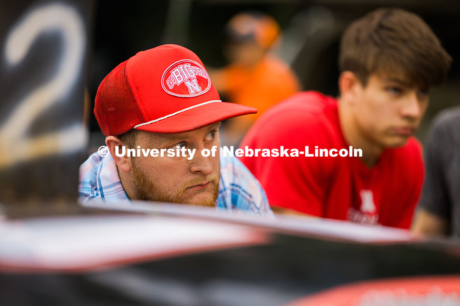 Jace Grunden, agricultural engineering major looks at team members as they try to get the race car w
