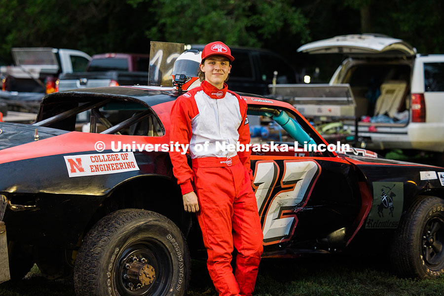 250717_Engineering_8289.jpg Ian Gouldie, UNL robotics engineering student, poses by the UNL Figure 8 racecar at the Saline Count