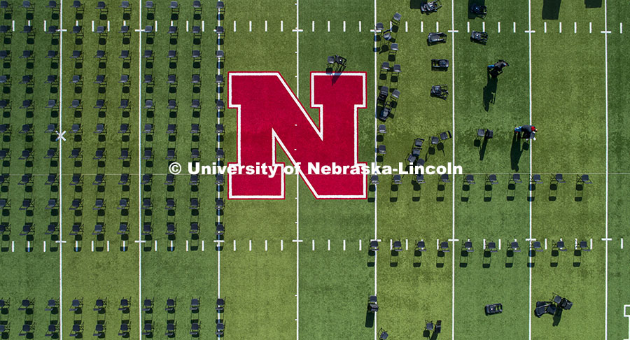 Chairs are set up on Tom Osborne Field in Memorial Stadium for Saturday’s commencement. May 6, 202