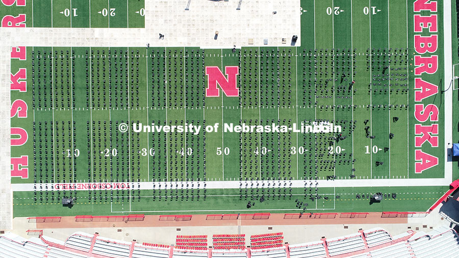 Chairs are set up on Tom Osborne Field in Memorial Stadium for Saturday’s commencement. May 6, 202