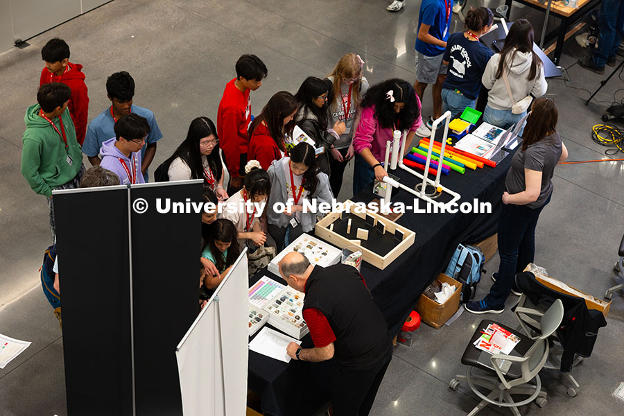 Students gather at the Ward's Science exhibit during the Science Olympiad National Tournament STEM E