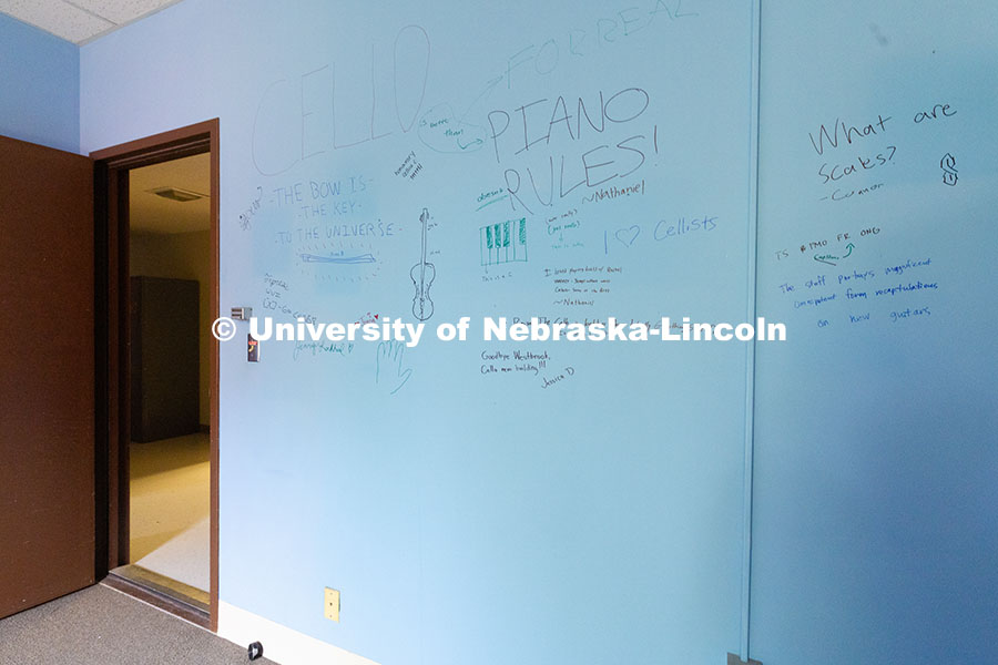 250530_Westbrook_9429.jpg Students write their farewells on the wall of an office in the old Westbrook Music Building and expr