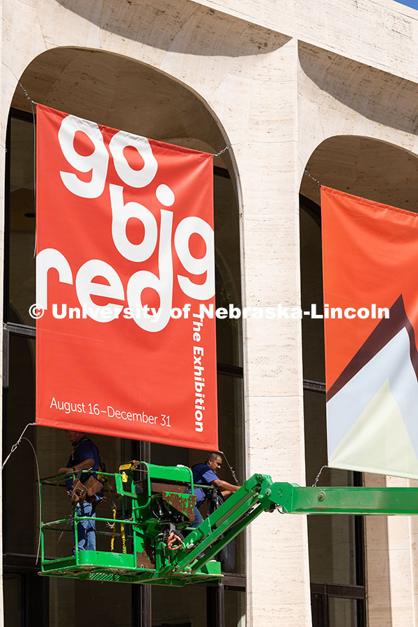 250729_Sheldon_2929.jpg Justin DeBoer (left) and Geraldo Martinez (right), both exteriors technicians at UNL, adjust the cab