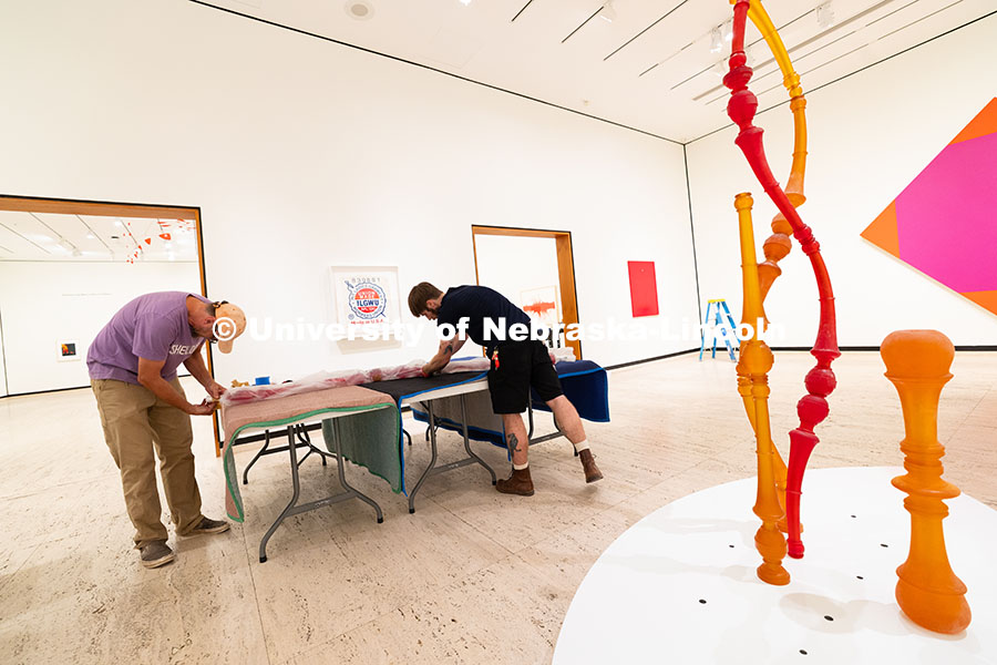 250729_Sheldon_3147.jpg Delan Lonowksi and Quentin Fortney, on-call exhibition technicians for the Sheldon Museum of Art, un
