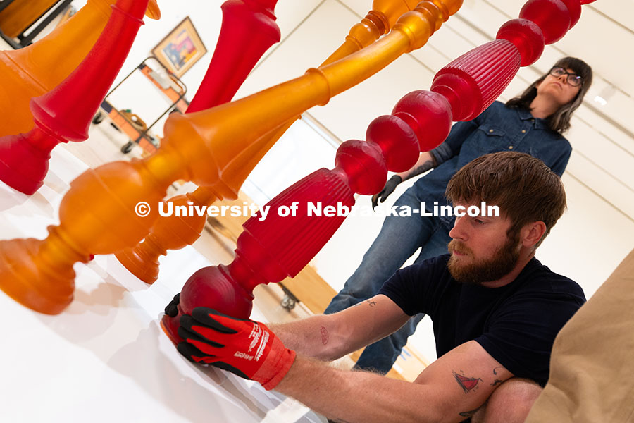 250729_Sheldon_3191.jpg Quentin Fortney, an on-call exhibition technician for the Sheldon Museum of Art, fits part of Niho K