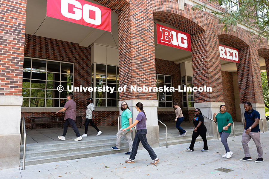 Graduate students studying chemistry and biochemistry walk together from Hamilton Hall to the Nebras