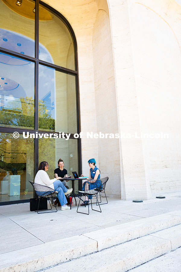 250813_City_Campus_3492.jpg Sydney DeRoin, Chloe Burgett and Jordan Nova, all employees of the Sheldon Museum of Art, enjoy work