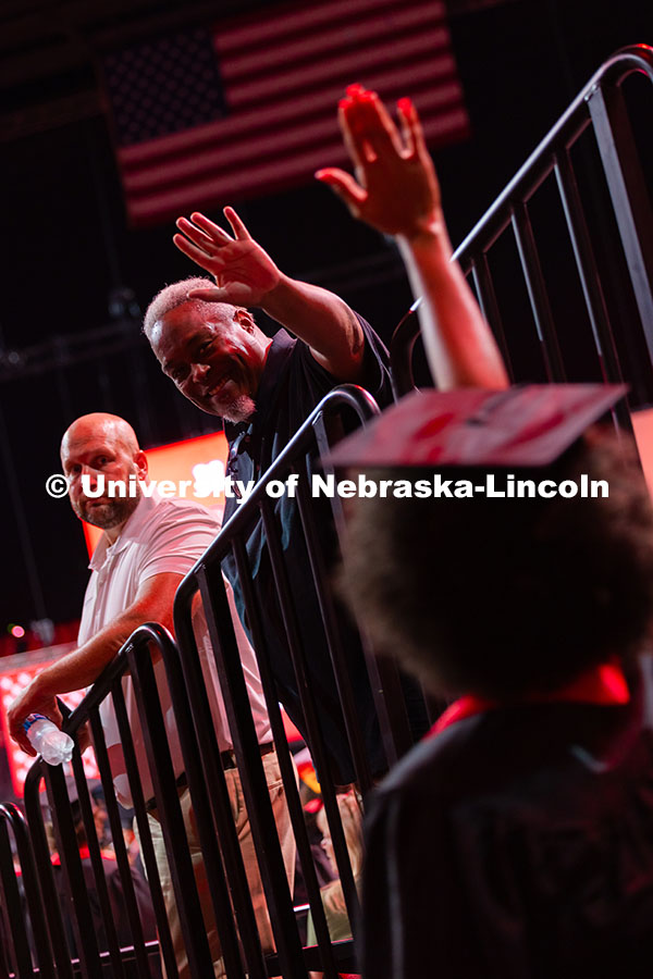 250816_Commencement_3518.jpg Jordan Ramsey leans over the railing to give his daughter, Jordan Ramsey, a high five as she enters