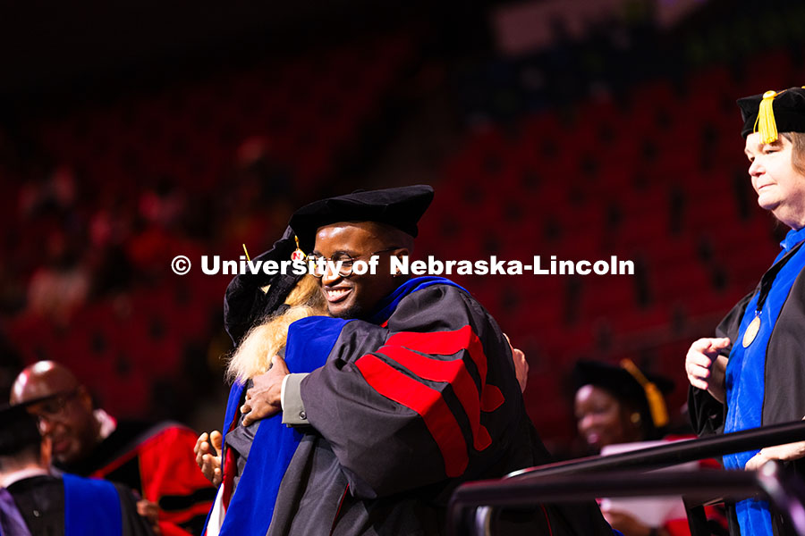 250816_Commencement_3699.jpg Esihle Lupindo hugs Professor Lisa Kort-Butler after being hooded. Lupindo received his doctorate in