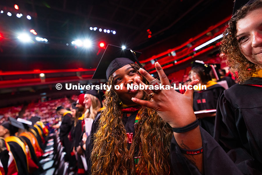 250816_Commencement_3715.jpg Amara Smith Speights holds out her ring. Smith Speights was part of the championship-winning Husker