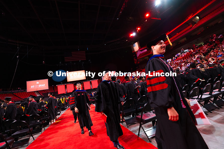 250816_Commencement_3725.jpg Wajdi Belgacem follows his adviser, Professor Jay Parsons, out of Pinnacle Bank Arena after receivin