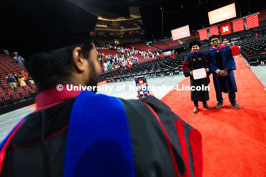 250816_Commencement_3753.jpg Muhammed Sinan Rasiya Koya snaps a photo of Shivendra Srivastava and their adviser, Assistant Profes