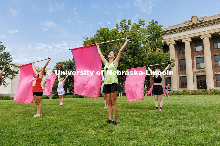 250819_Color_Guard_242.jpg Jocelyn Pohl practices the Cornhusker Marching Band’s Color Guard routine in front of Pound Hall d