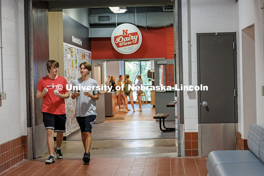 250820_East_Ice_Cream_169.jpg Rush Chipman and Dylan Cooper (left to right) chat as they leave the Dairy Store with ice cream duri