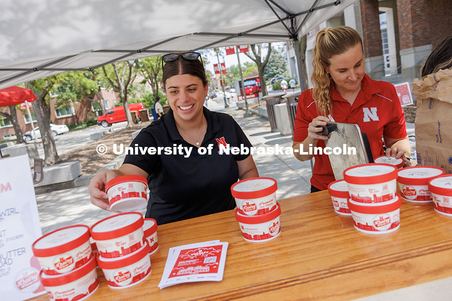 Kalan Walters (left), a Project and Events Coordinator, hands out ice cream at the Union Plaza with 