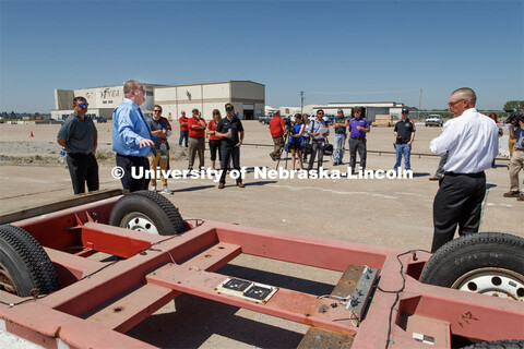 Ron Faller, left, and Bob Bielenberg, right, explain various test areas of the facility to the NASCA