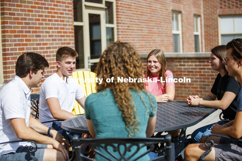 Students hanging out on the roof of the Kauffman Academic Residential Center. Raikes school photo sh