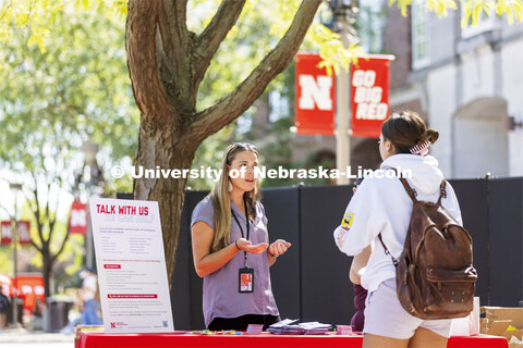 Mariah Petersen, a CAPS outreach coordinator talks with a student at the counseling and psychologica