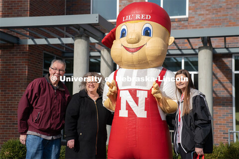Students pose with Lil’ Red near the Van Brunt Visitor’s Center. Admitted Student Day is UNL’s