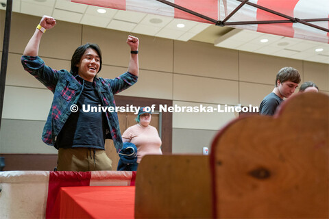 Students play carnival games during the End of Year Bash inside the East Campus Union on Saturday, A
