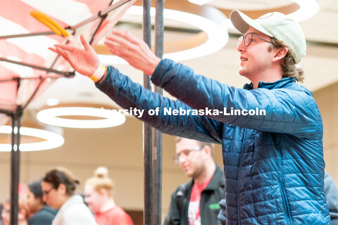 Students play carnival games during the End of Year Bash inside the East Campus Union on Saturday, A