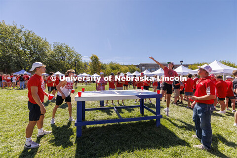 Students play Beer Die at the Student Tailgate and Unity Walk in the Union green space before the ga
