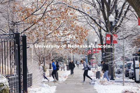Students crossing campus. Ice and snow cover campus. January 19, 2023. 