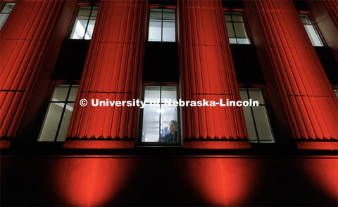 Jenna Baum, a junior in psychology, takes a break from studying in Love Library to look out at the l