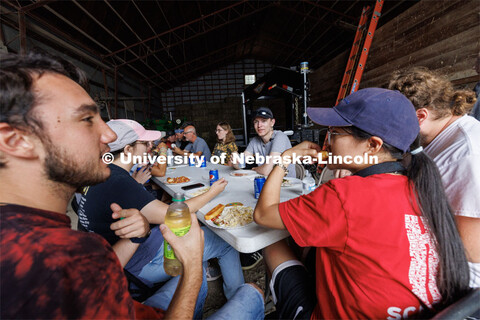 Students, talent and professionals break for lunch in an adjoining farm shed. Filming of the movie u