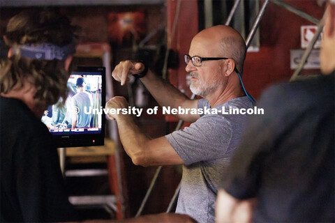 Richard Endacott discusses a scene being replayed on the monitor. Filming of the movie using UNL stu
