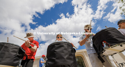 Avryn Schardt of Ankeny, Iowa, practices with the drum line. Cornhusker Marching Band camp practice.