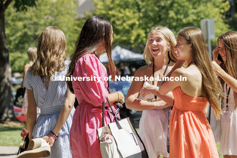 Elliot Brown talks with friends in between events during the Sorority Recruitment Philanthropy Round