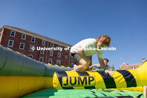 Brady McGerr jumps over the spinning inflatable at Hanging with the Huskers. September 29, 2023. 
