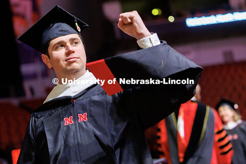 Heath Howard pumps his fist after receiving a Master of Arts. Graduate Commencement at Pinnacle Bank