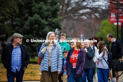 Dagny Edwards (right) laughs with her family as they walk to the coliseum after the Presidential Sch