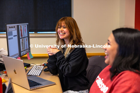 Katia Henrriquez smiles as her and the Design Studio team work on their AI program for Nebraska-base