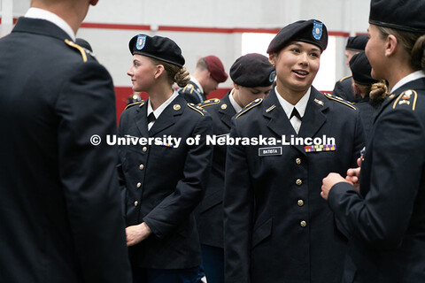 Alyssa Batista (right) chats with fellow ROTC students before the ceremony begins. Joint Service Cha