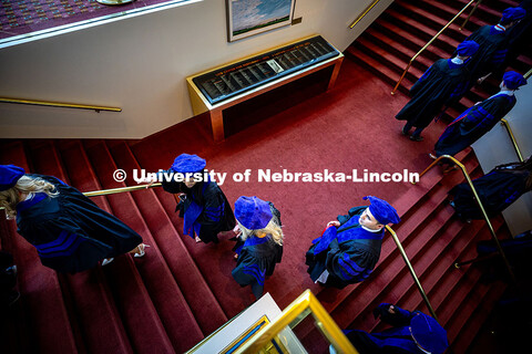 Graduates climb the stairs into the Lied Center prior to the graduation ceremony. 2025 College of La
