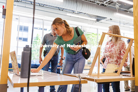 Grace Besse, a senior Forensic Science major, checks out a project called “Mossense” at the John