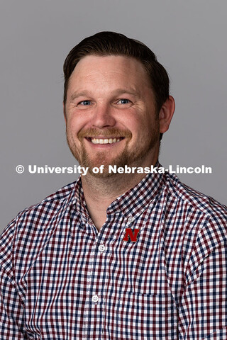 Studio portrait of Adam Christiansen, Academic Navigator for Undergraduate Education and Student Suc
