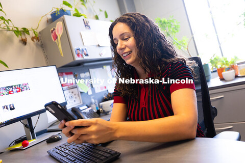 Stephanie Cerrato-Rodriguez, academic navigator for the College of Arts and Sciences, checks in on a